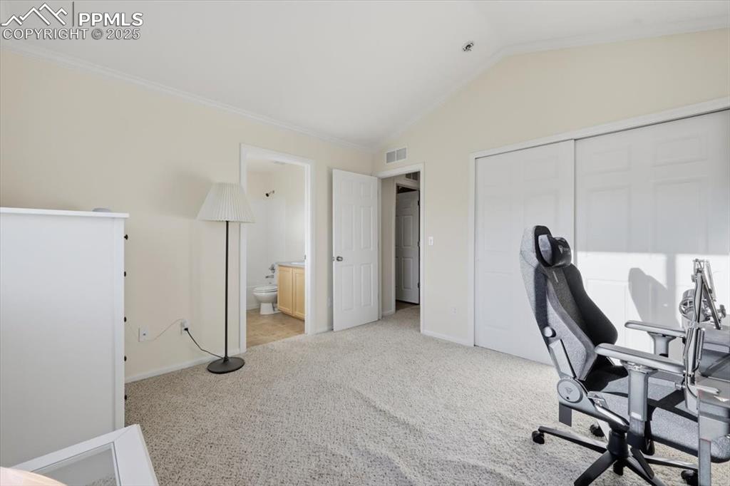 Upper level junior suite with attached bathroom.