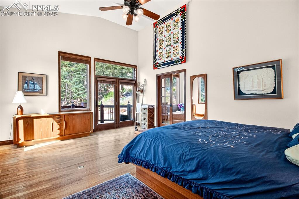 Primary bedroom with walk out to deck with hot tub, an en suite bathroom and walk in closet!