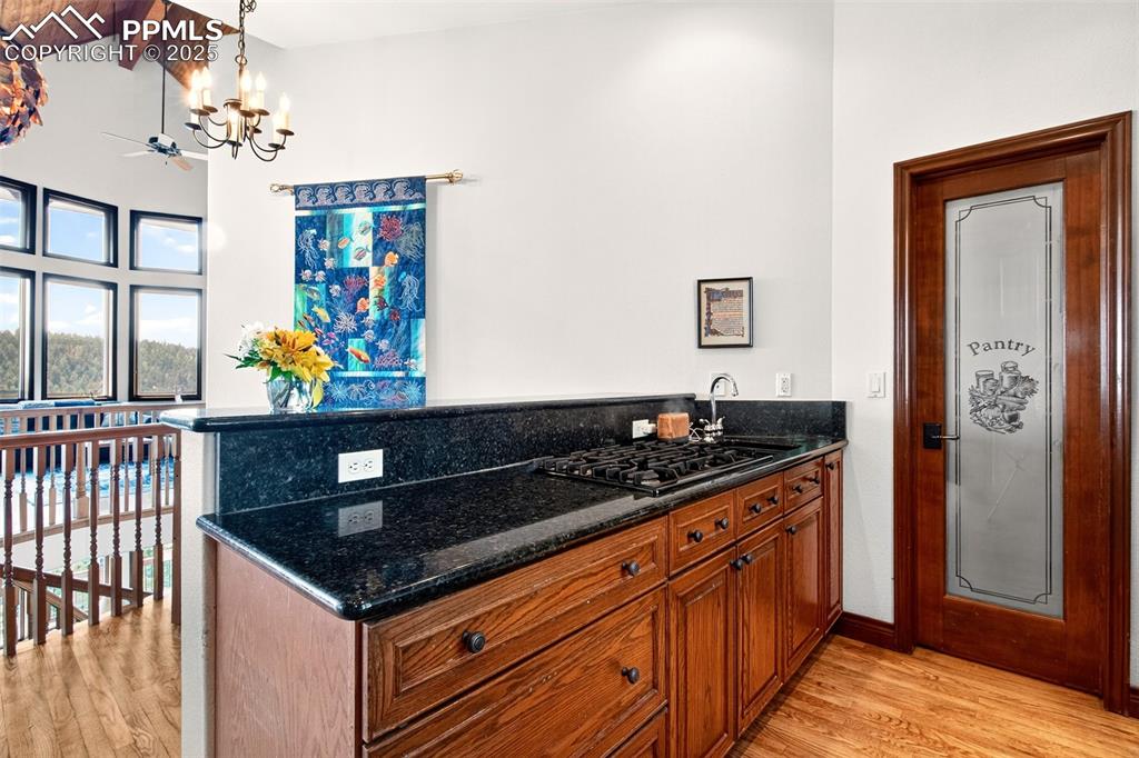 Kitchen island with walk in pantry ands breakfast area