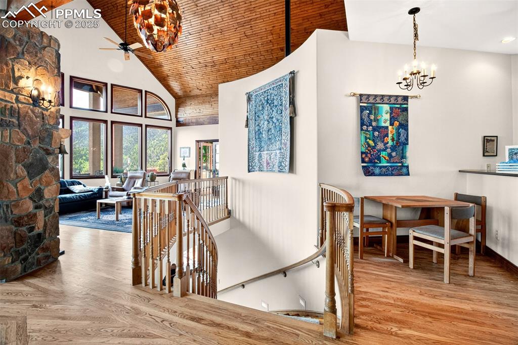 Upper level landing heading to lower level. Notice the custom copper pinecone light above!