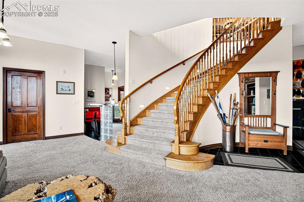 Recreation room on lower level with wood burning fireplace and a  walk out to back deck equipped with a sauna