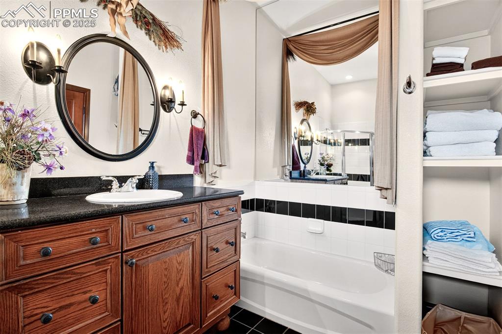 Full bathroom on the lower level equipped with tub and stand alone shower 