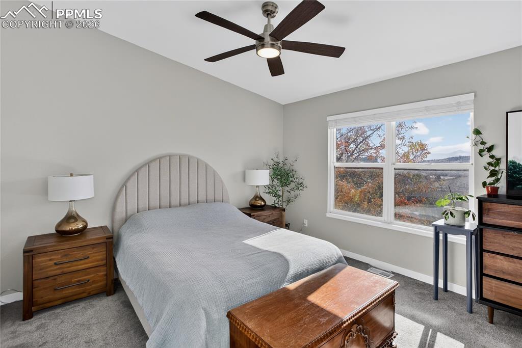 Primary bedroom w/ vaulted ceiling
