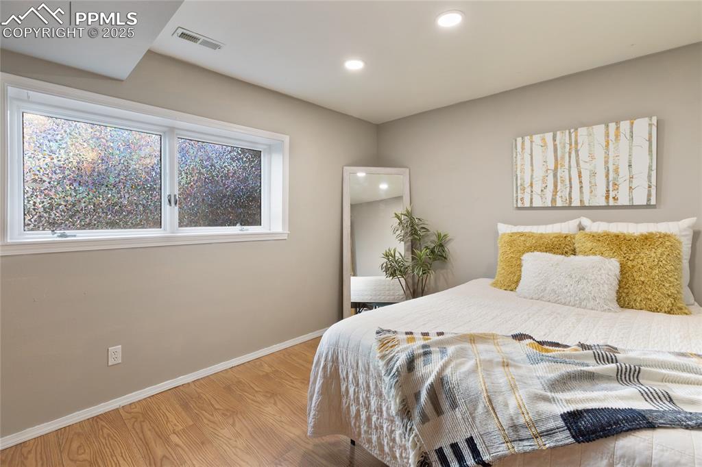 Basement guest room with large windows