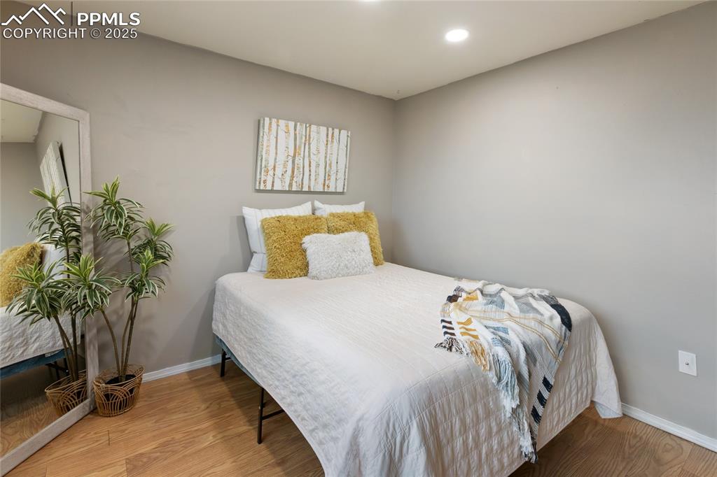 Bedroom featuring light wood-style flooring and recessed lighting