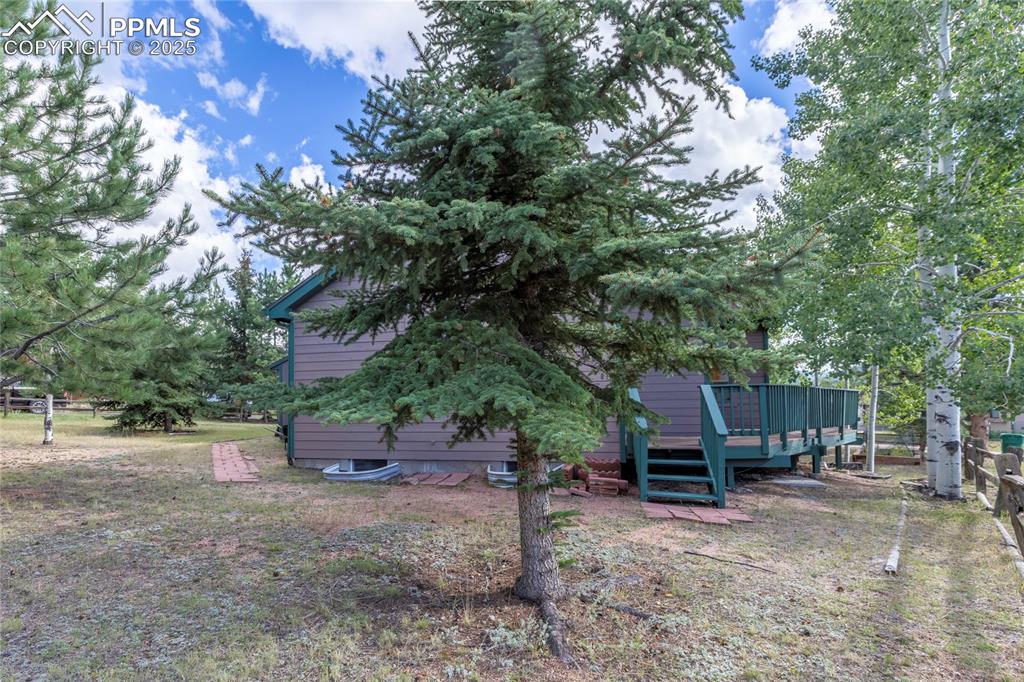 View of yard featuring a deck