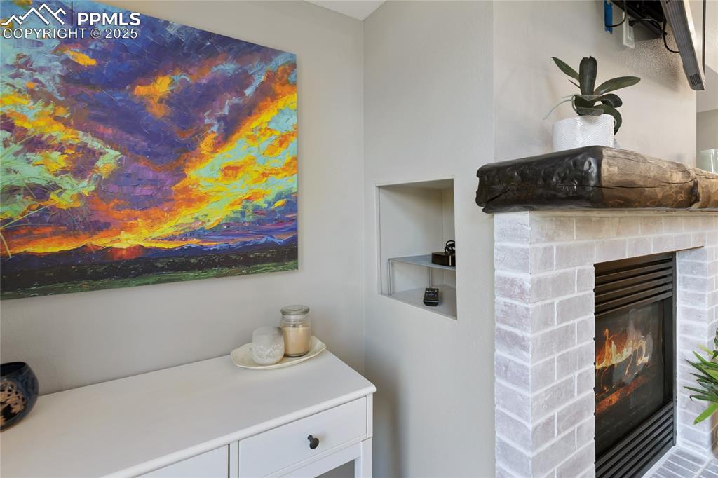 Niche hides electronics cords and keeps remotes tidy