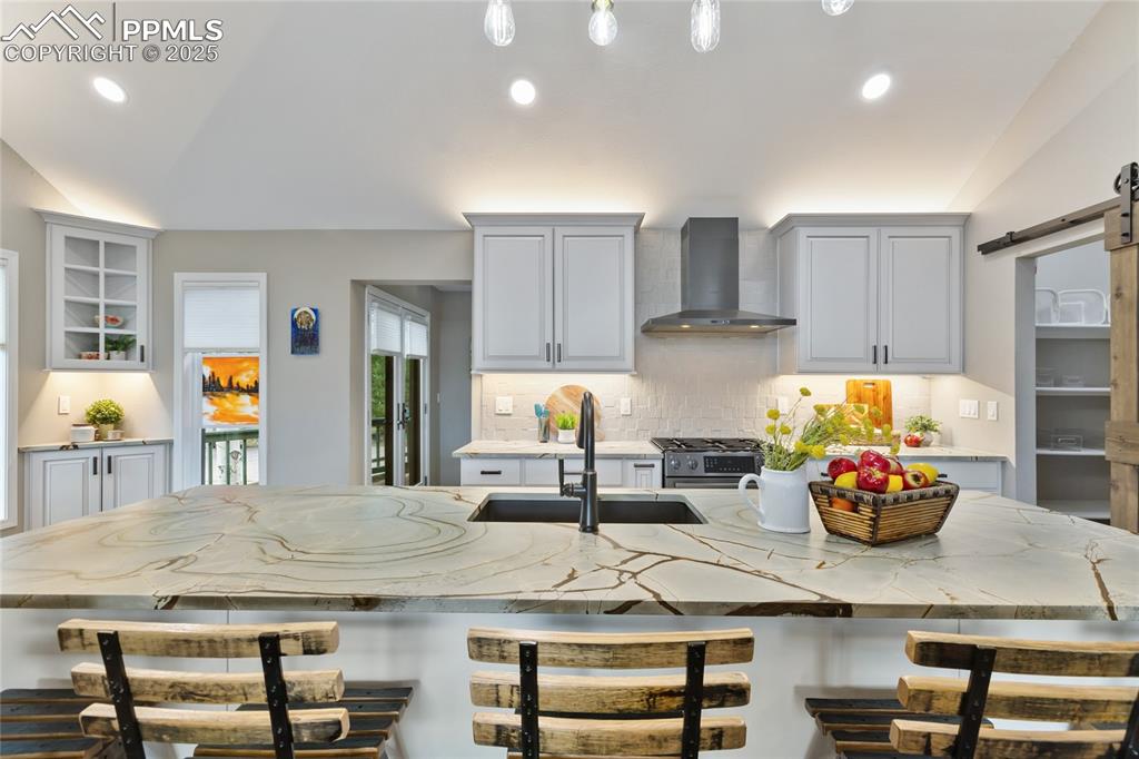 Gorgeous luxury kitchen with Blue Roma Leather finished stone slab countertop