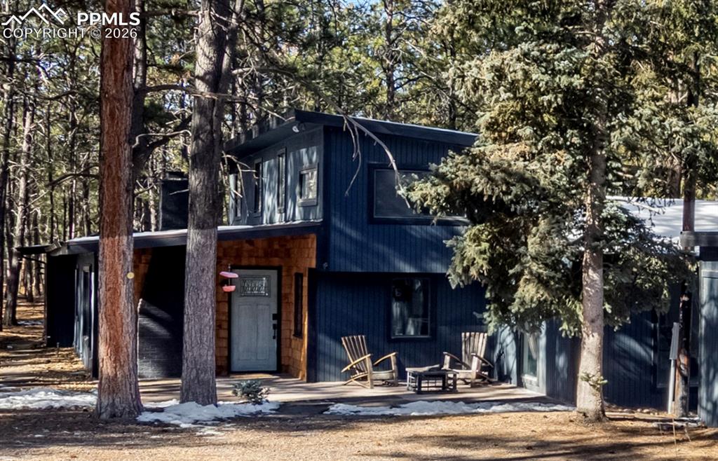 View of front of house with an outdoor fire pit