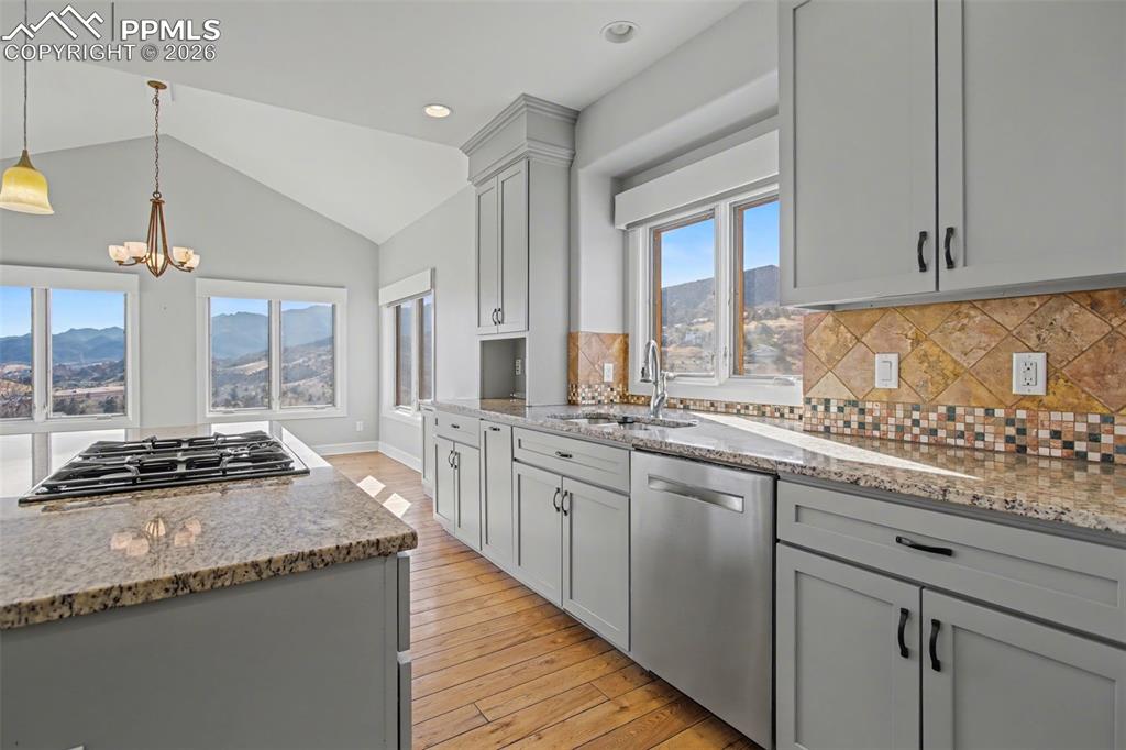 Kitchen with granite countertops and stainless steel appliances.