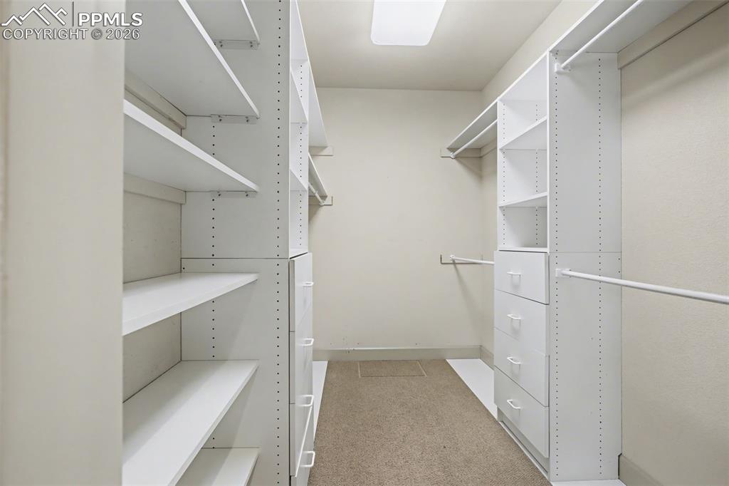 Primary bedroom walk-in closet.