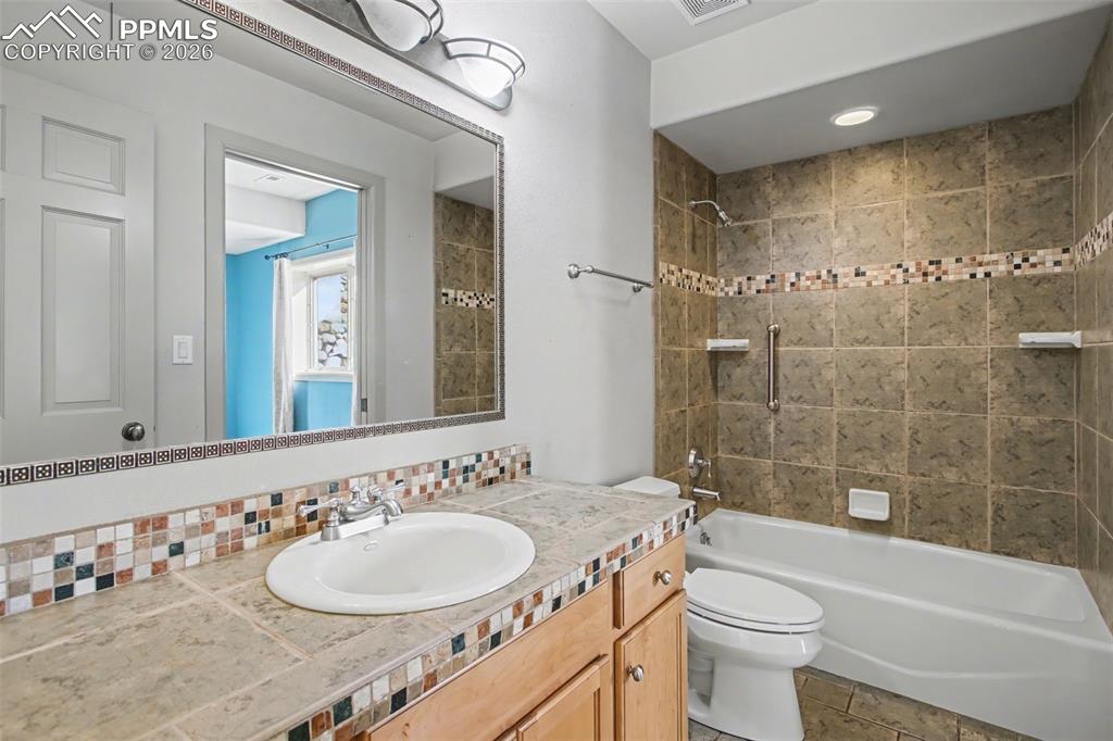 Adjoining full bathroom in basement.