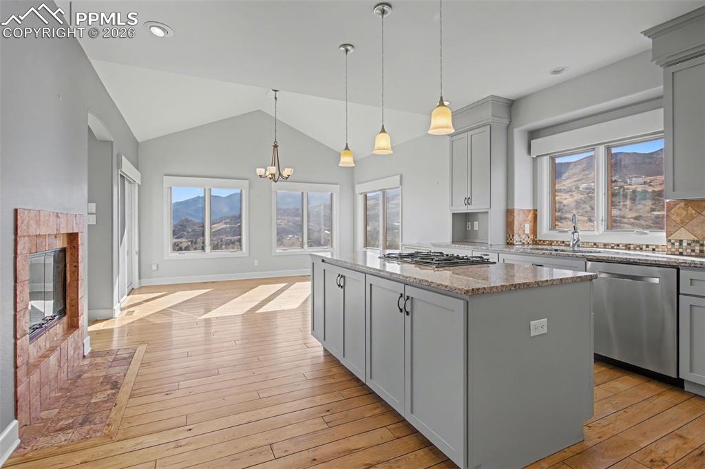 Kitchen with fireplace and island.