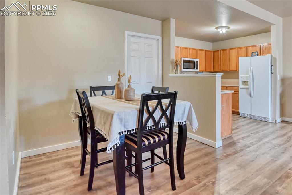 Dining area featuring light wood-type flooring