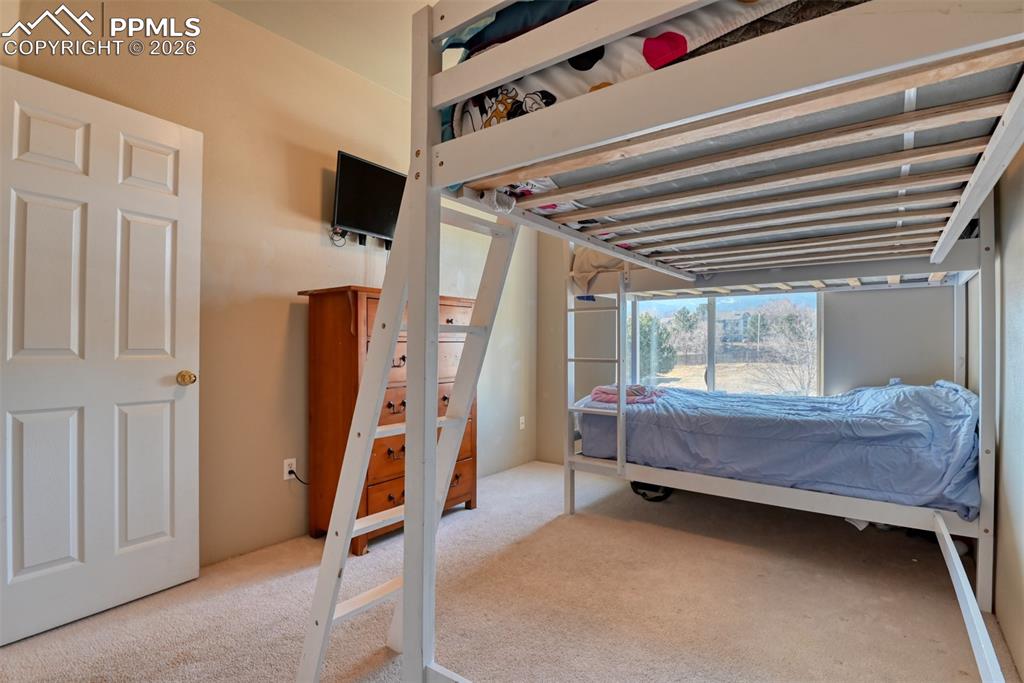 Bedroom with light carpet