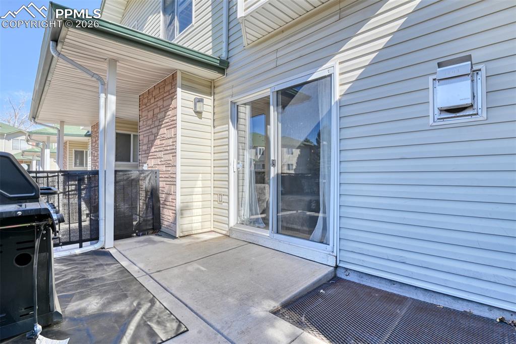 View of patio featuring area for grilling