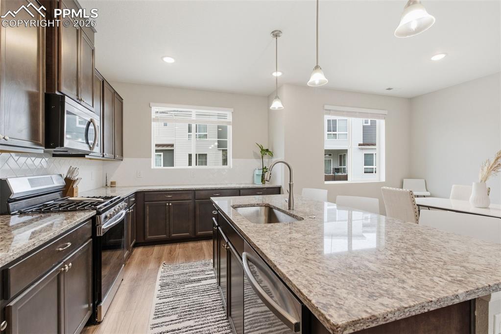 All stainless appliances are included with gas range and washer dryer conveniently located near upstairs bedrooms