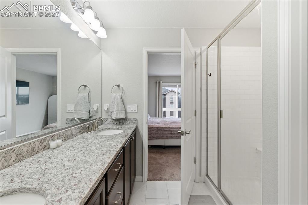 Granite counters & shower is to the right