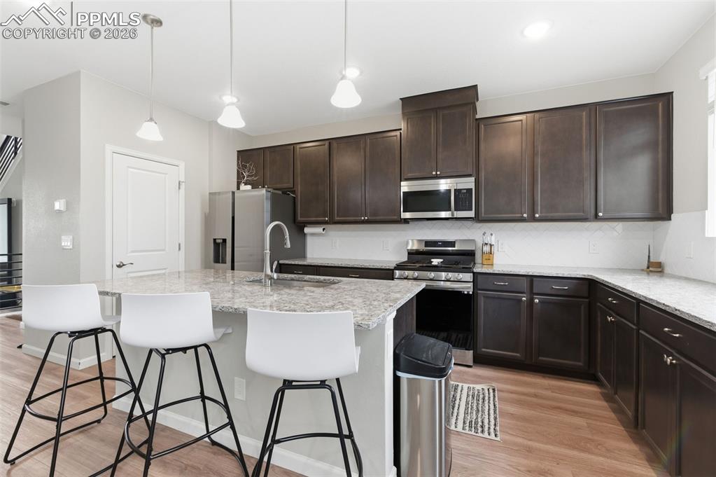 Pendant lights over spacious center island