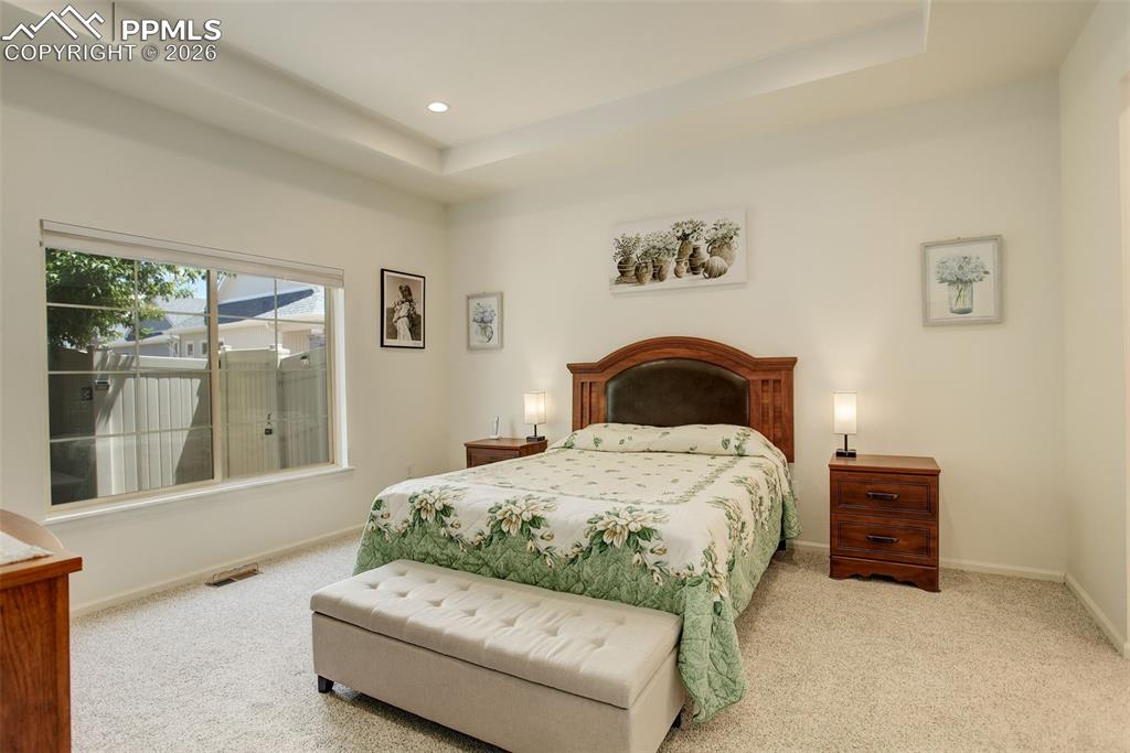 Primary bedroom with ensuite bathroom and lovely natural light