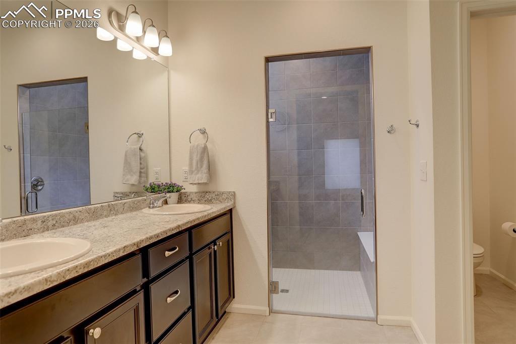 Dual vanity, zero entry shower and large walk-in closet
