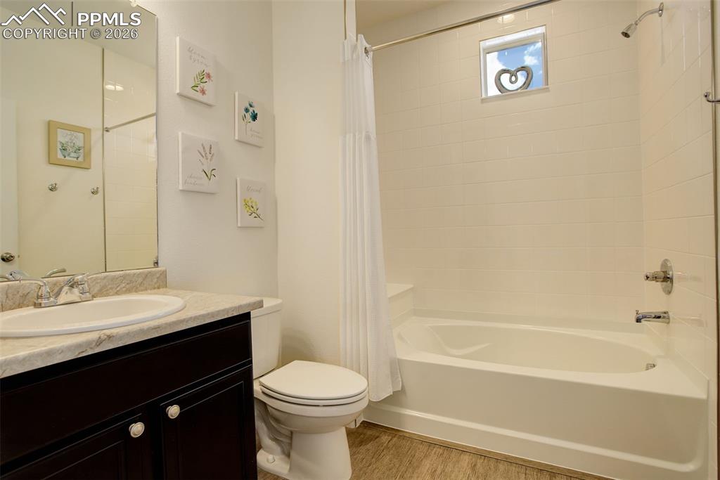 Full bath located near front bedroom 