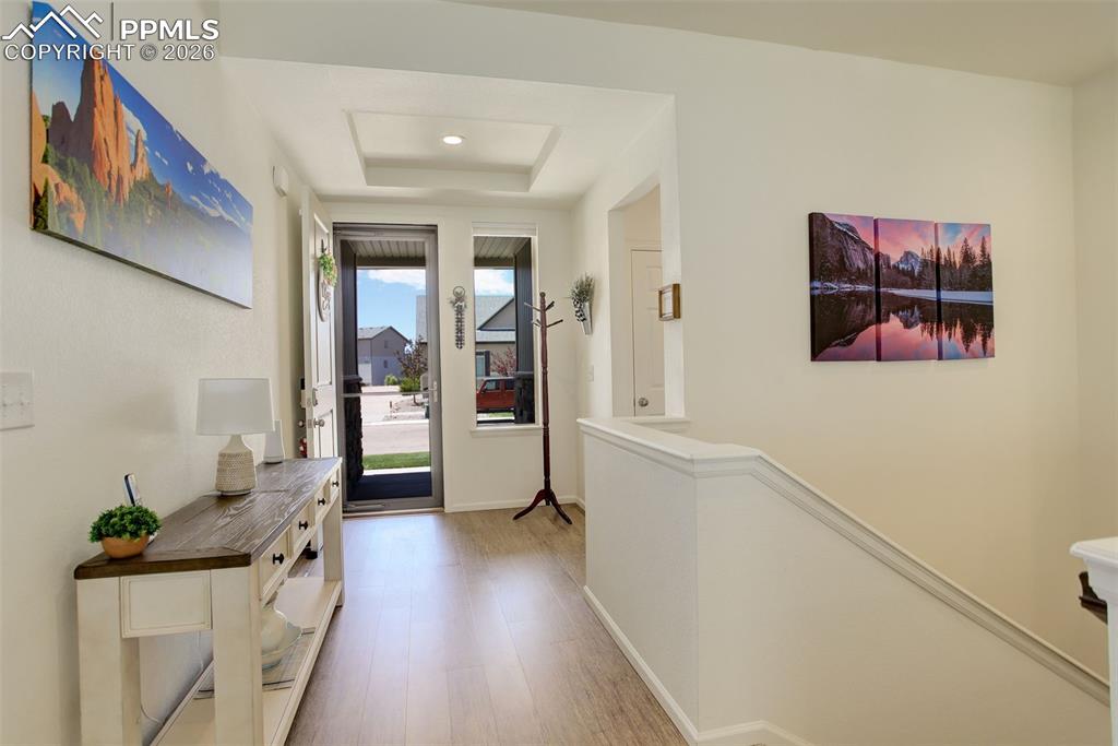 Entry featuring LVP and open layout