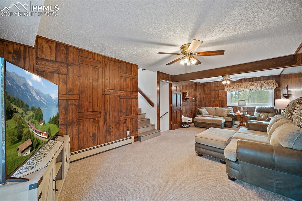 2nd level offers this wonderful space for family night and walks out to the deck for BBQ's.    