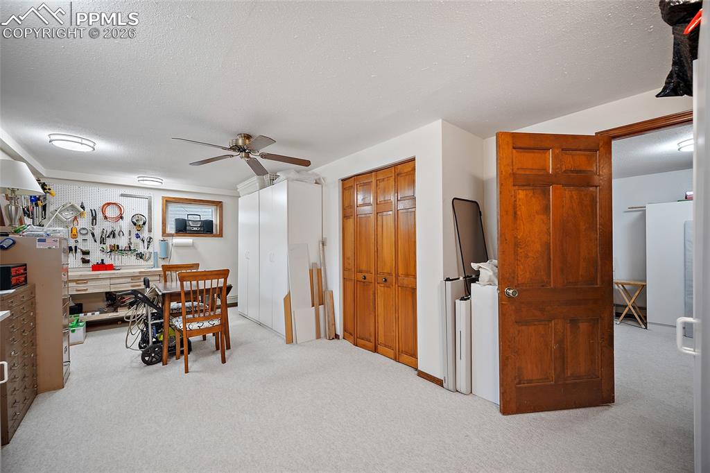 The 4th bedroom with adjoining 3/4 bath.  Being used as a hobby room.