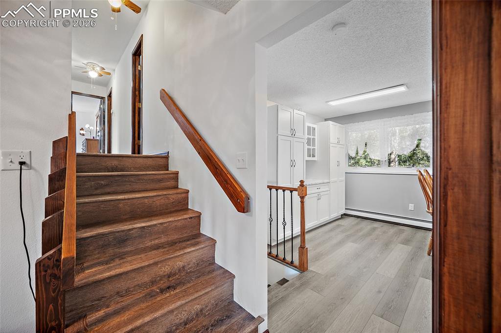 The stairs lead to the upper-level bedrooms.  