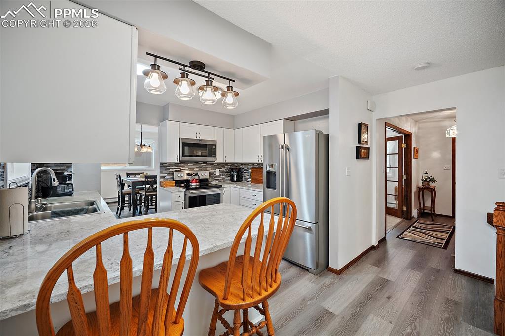 Beautiful gourmet kitchen with all upgraded appliances and breakfast bar.  