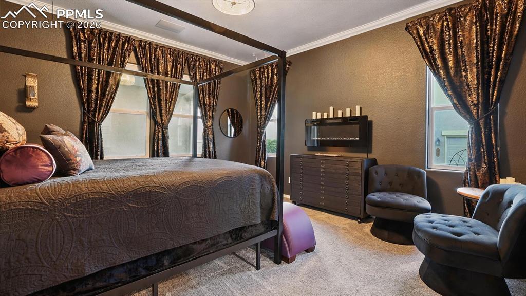 Main Level Primary Suite with custom walk in closet and luxurious 5pc Spa Bathroom.