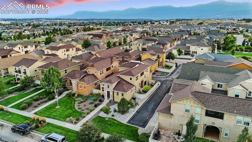 Aerial view of home and corner lot.