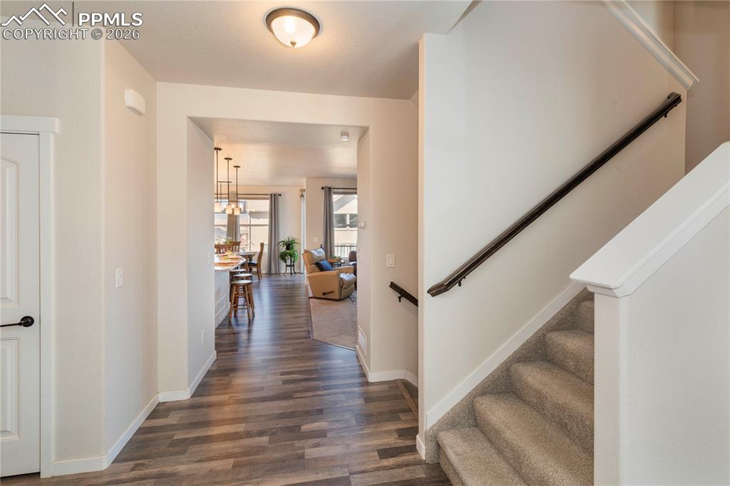 Foyer entrance includes a powder room, coat closet, front office and LVP flooring.