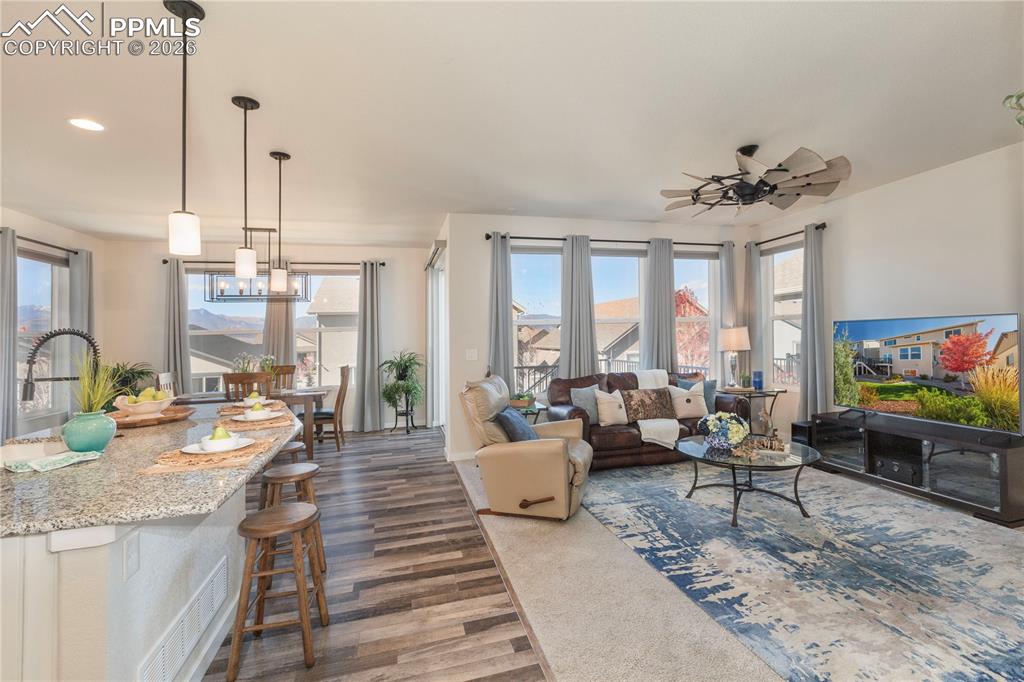 Bright, open concept living, dining and kitchen area featuring panoramic mountain views.