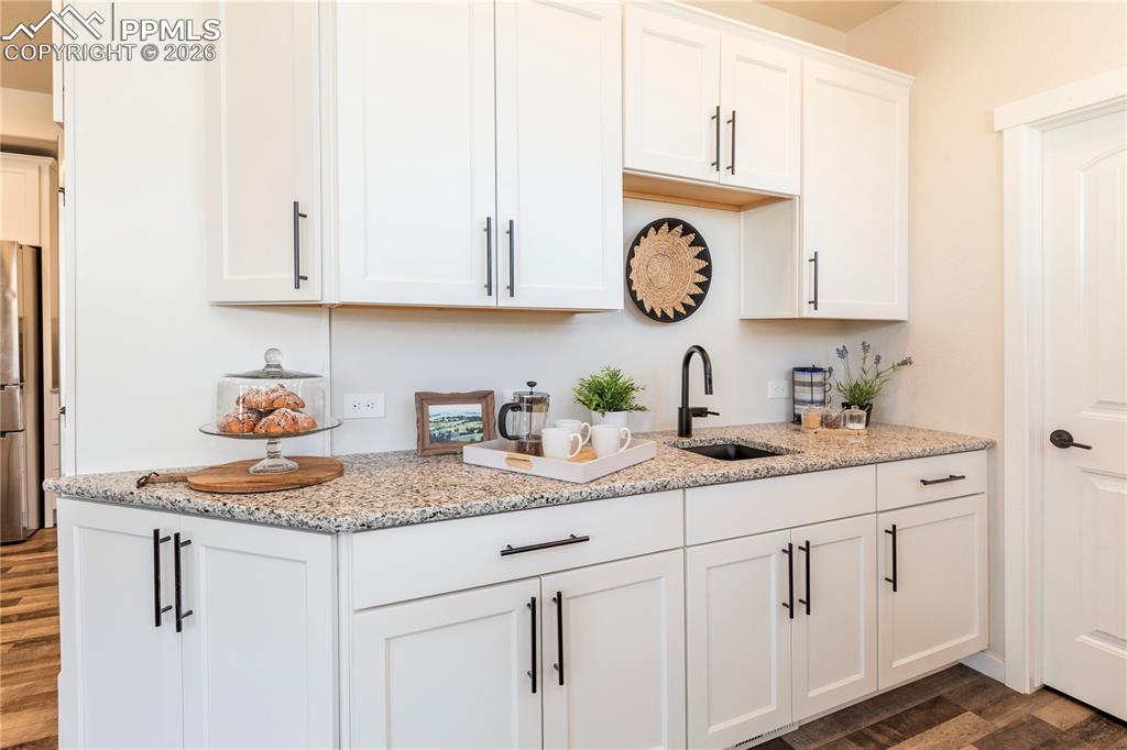 Second sink, tons of cabinetry and a walk-in pantry.
