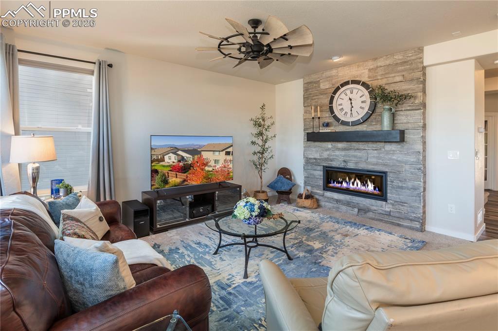 Cozy gas fireplace creates a dramatic focal point.