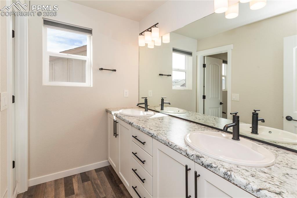 Bathroom #4 is a full-size bath with a double vanity...