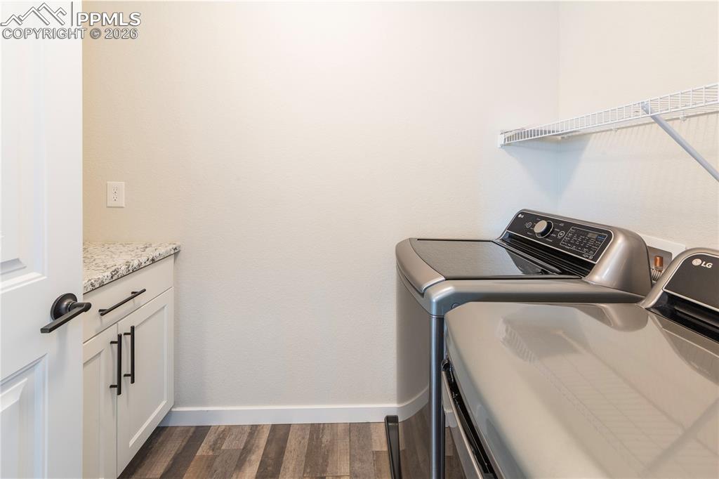 Upstairs Laundry room with LG washer and dryer, plus more built-in storage.