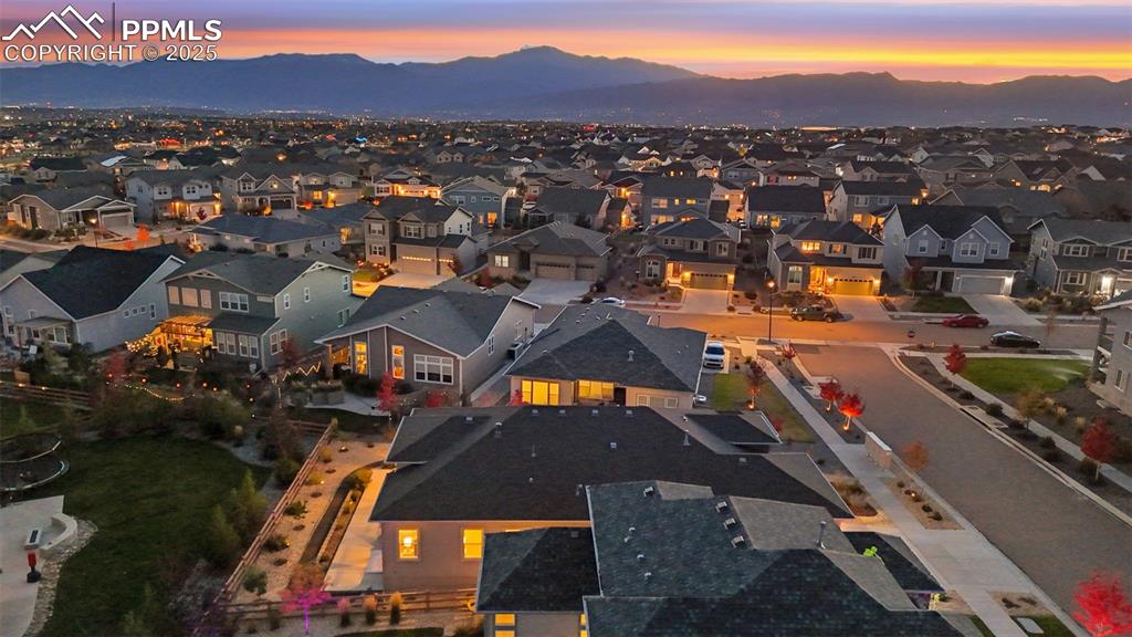 Aerial view of residential area featuring a mountain backdrop