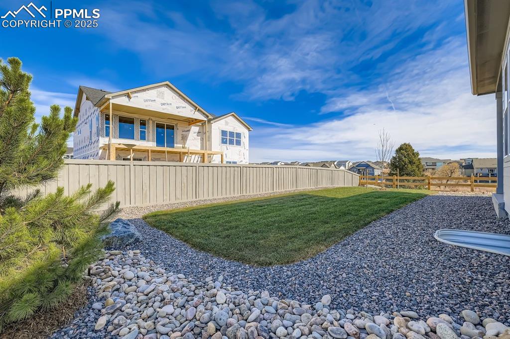 View of fenced backyard