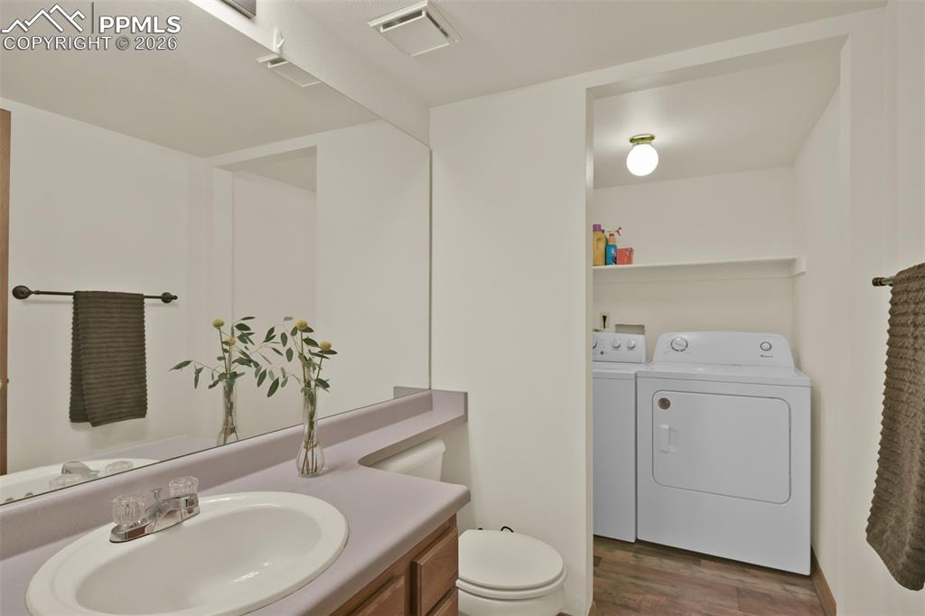 Main level 1/2 bathroom and laundry area. 