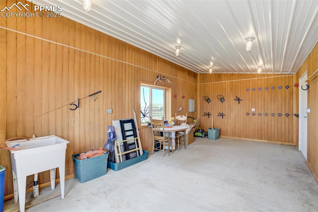 Garage featuring wooden walls
