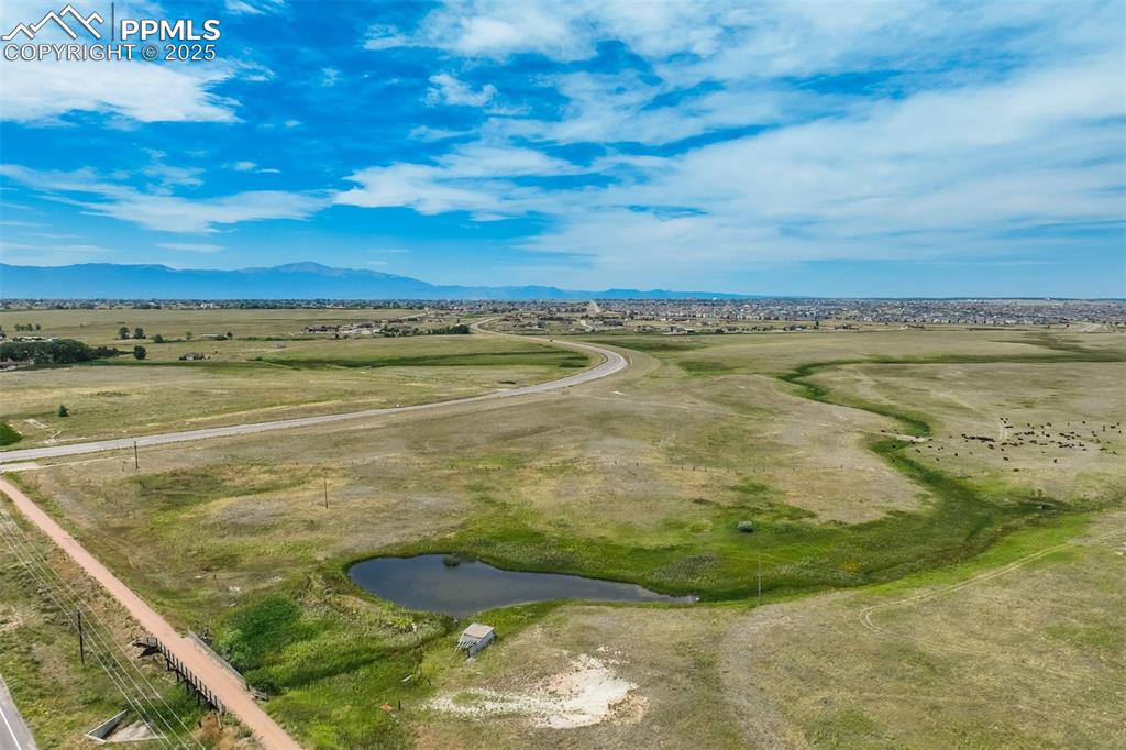 Aerial view of sparsely populated area featuring a mountain backdrop