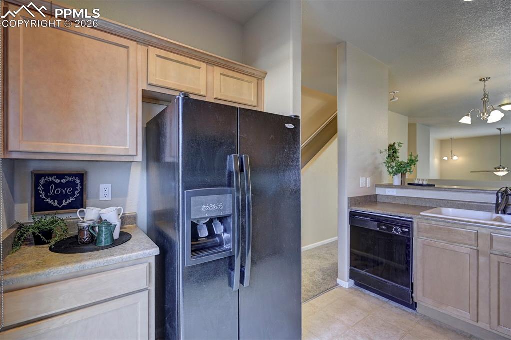 Great coffee station area by the refrigerator.
