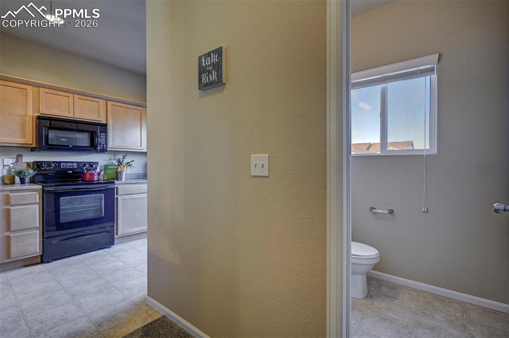 Half bath off of kitchen and dining area.