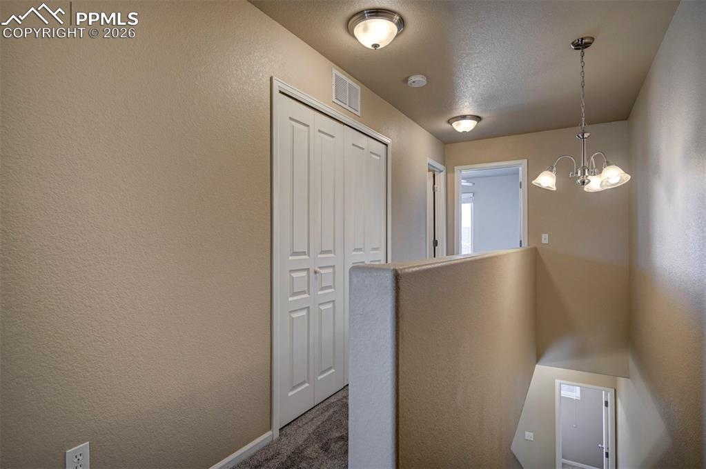 Hallway to the two bedrooms, laundry area, full 2nd bathroom and closet.