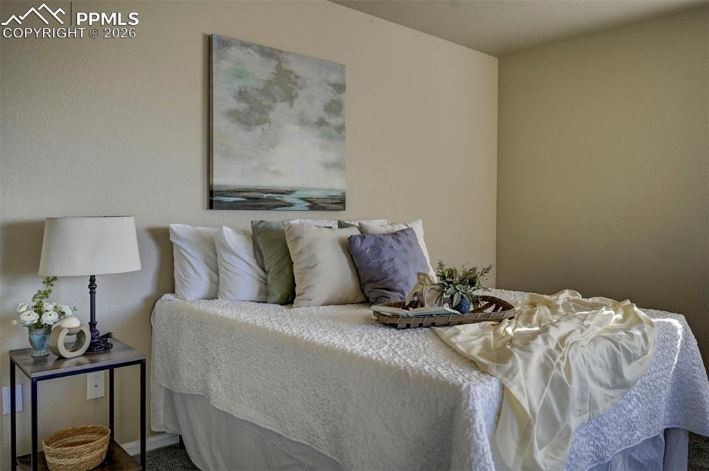 Primary bedroom at top of stairs.