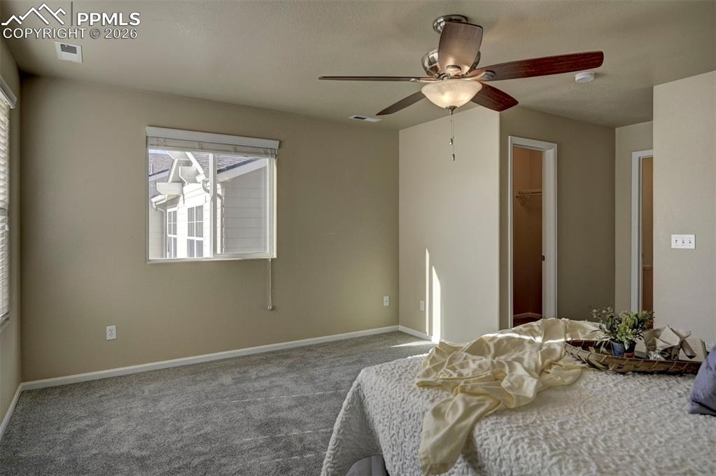 Large walk in closet and full bathroom are connected to primary bedroom.