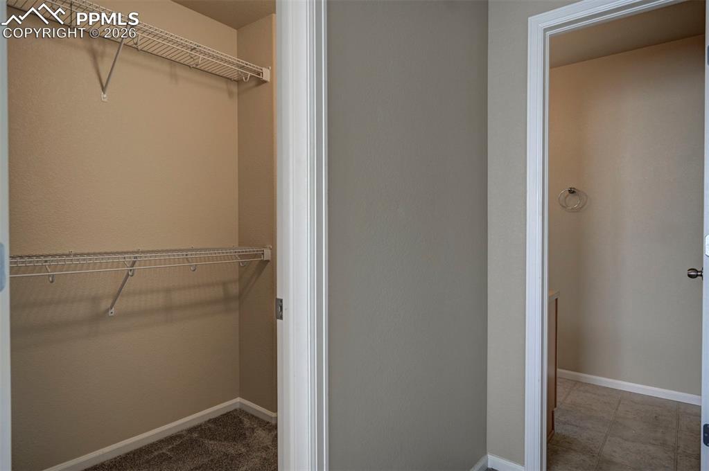 Large primary bedroom walk in closet. 